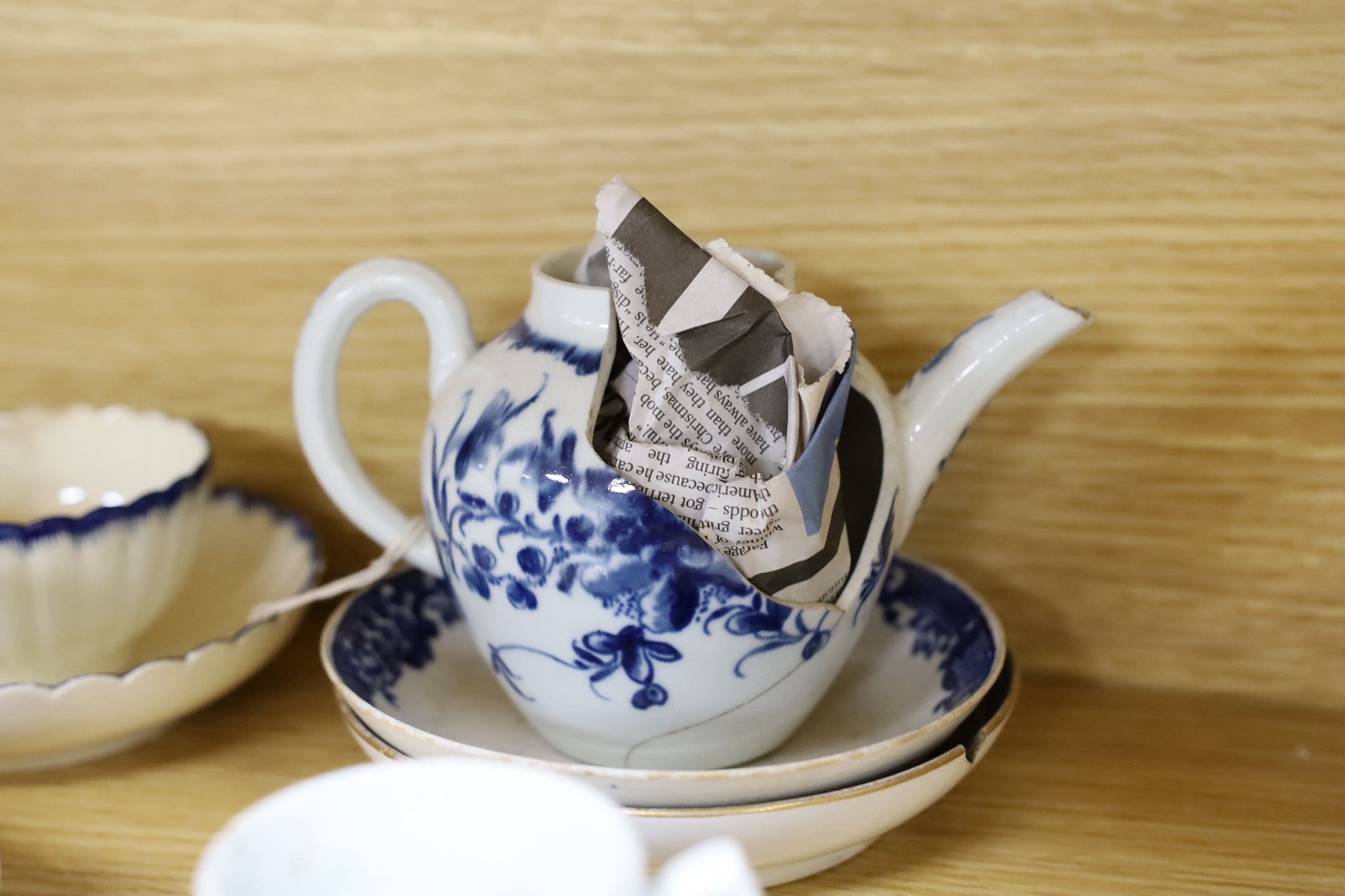 A large group of 18th century Worcester, Caughley and Liverpool blue and white tea bowls, coffee cups and saucers etc. including a Bow Cross-Legged Man